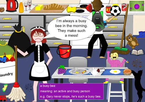 A cartoon-style illustration of a chaotic kitchen with a maid holding a mop, looking frustrated. A speech bubble above her says, "I’m always a busy bee in the morning. They make such a mess!" The kitchen is filled with clutter: a man holding a football and a plunger, a crying baby in a high chair, spilled food, laundry, and a black cat reaching for a donut. A text box at the bottom defines "a busy bee" as an active and busy person with an example sentence.